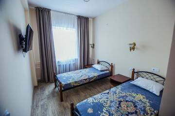Фото номера Двухместный номер с 2 отдельными кроватями Отель Europa Hotel г. Уральск 4